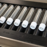 Labelling-test-tubes-on-roller-conveyor